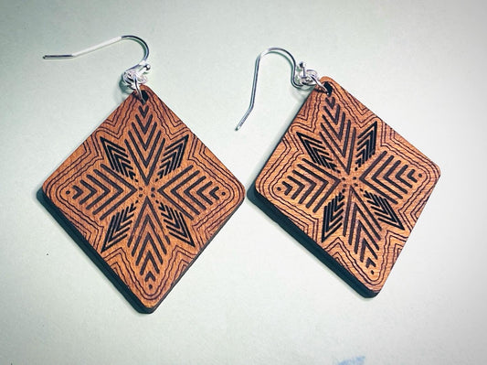 Laser cut, hand sanded and stained earrings with quilt inspired pattern.
